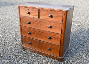 A Victorian mahogany chest of two short over three long graduated drawers with turned handles, the