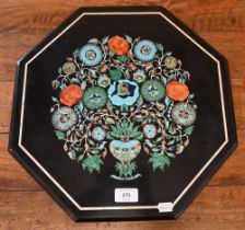 An octagonal stone table-top, inlaid with an extravagant vase of flowers in malachite and other