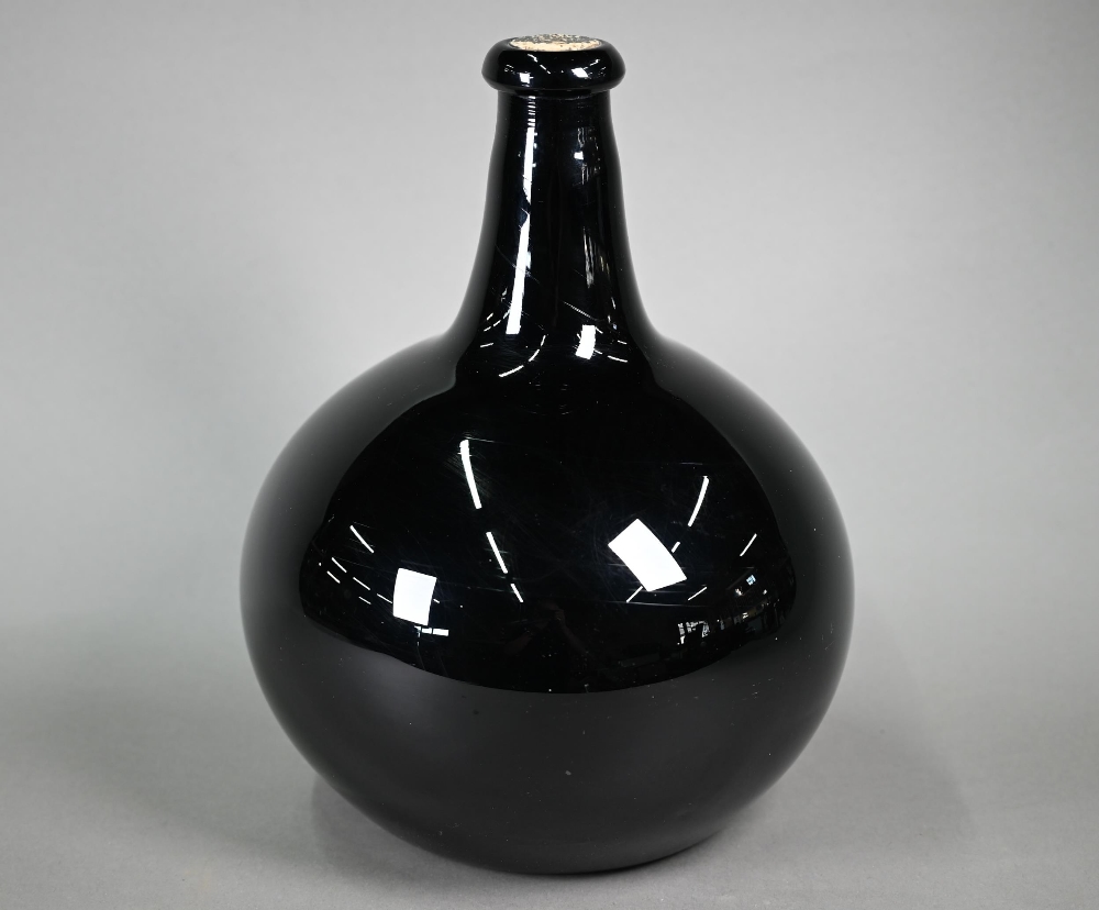 A large antique amethyst glass globular bottle of onion form, with slender tapering neck, 33 cm high