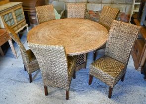 An Oka Beaumont all-weather rattan circular table, 150 cm dia. x 75 cm h to/with six similar