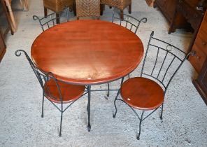A contemporary circular teak top steel framed dining table, 106 cm dia. x 76 cm h to/with a set of