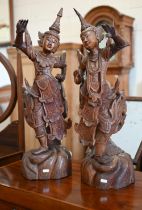 Two Burmese carved wood figures of Temple dancers, 66 cm high