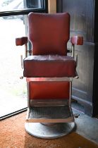 A vintage red vinyl barber's chair, a/f