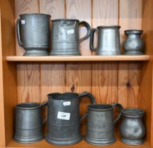 Eight various antique and later pewter tankards and measures