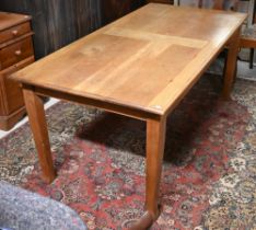 A small oak dining table raised on square tapering legs, 179 cm x 87 cm x 73 cm h