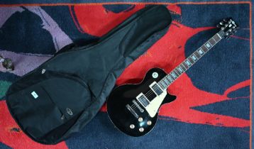 A 'Gear 4 Music' Tele shape electric guitar (black body with cream trim) to/w Ritter soft case
