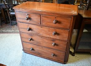 A Victorian mahogany chest of two short over three long drawers, each with original turned wooden
