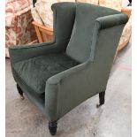 An early 20th century mahogany framed wingback armchair, green corduroy fabric