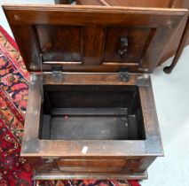 A panelled oak slipper/coal box on bun feet, 50 x 36 x 36 cm h