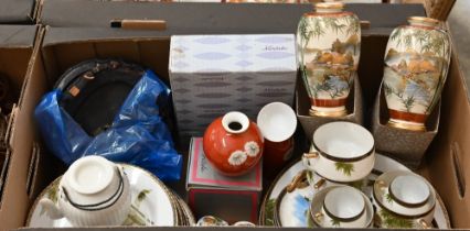 A boxed Noritake sake set with floral decoration to/w a matching small globular vase, a boxed pair