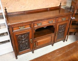 A late 19th century carved and moulded mahogany sideboard with gallery back, raised on turned feet