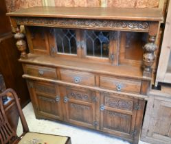 A vintage Old Charm part lead glazed and linenfold panelled carved oak court cupboard, 138 cm x 47