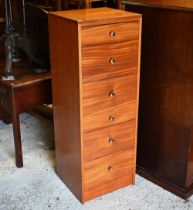 A mid century tall teak chest of six irregularly graduated drawers, 44.5 cm x 42 cm x 124 cm h