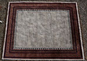 A modern hand-made Indian Kashmir 'Caravan' carpet, the central field with repeating design on