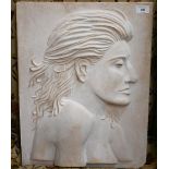 A cast stone relief plaque of a female profile, incised on reverse D Longman 2013 V, and impressed