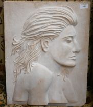 A cast stone relief plaque of a female profile, incised on reverse D Longman 2013 V, and impressed