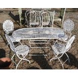 A painted metal lattice-work patio set comprising table, four chairs, two parasols to/w painted