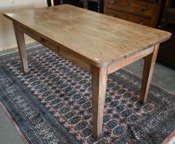 A provincial French fruitwood kitchen dining table, the four plank rectangular top with single