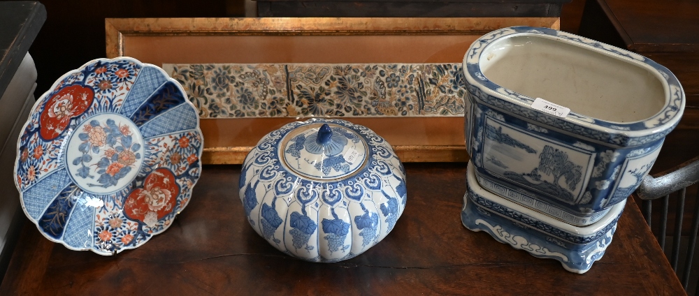 An Asian blue and white porcelain jardiniere on stand, 23 cm high, to/w a melon-shaped jar and