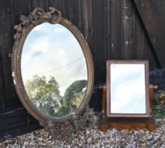 An antique oval girandole mirror to/with a toilet mirror (2)