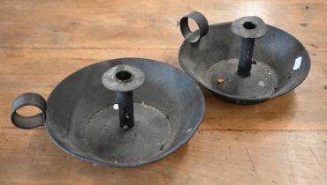 Two rustic painted metal chambersticks