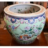 A Chinese porcelain fish-bowl, the interior painted with goldfish, the outside with flowers and