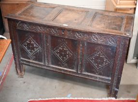 An antique panelled oak coffer (a/f, and with missing base), 118 cm wide x 50 cm deep x 70 cm high