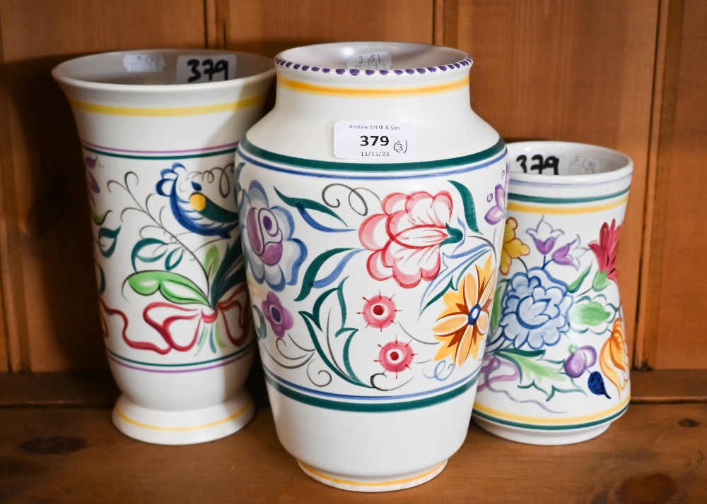Three floral-painted Poole pottery vases, 22 - 16 cm