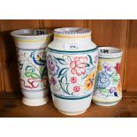 Three floral-painted Poole pottery vases, 22 - 16 cm