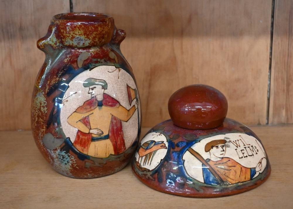 A French faience domed inkwell, painted with fragments of the Bayeux tapestry featuring William