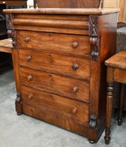 A large Victorian mahogany chest of drawers with cavetto drawer over four standard drawers, on bun