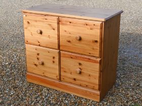 A stained pine four drawer filing chest, 100 cm x 50 cm x 86 cm high