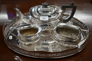 An epns half-reeded three-piece tea service, to/w an oval tray with pierced gallery (4)