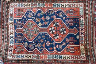 An antique Southern Caucasus rug, the blue ground with twin lozenge pole design, 135 cm x 90 cm