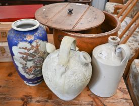 An antique glazed earthenware bread-crock with planked pine lid 46 cm diam to/w a Middle Eastern