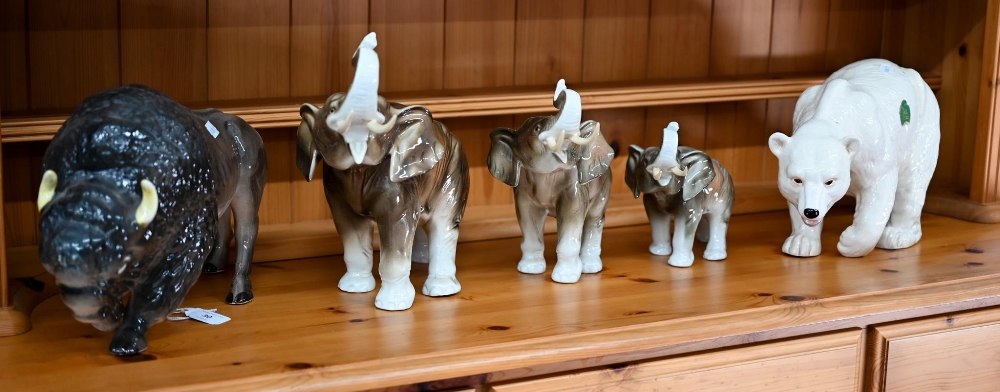 A graduated set of three Royal Dux elephants 25-15 cm to/w a large Melba Ware polar bear and buffalo