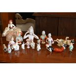 A collection of vintage china pin-cushion figures and reclining female figures, etc