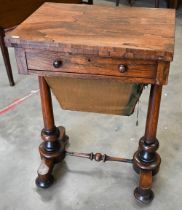 A Victorian rosewood folding sewing table with compartmentalised drawer and wool box on twin
