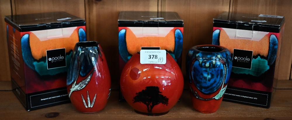 A boxed Poole pottery 'African Sky' 10 cm purse-vase, to/w two other boxed Poole red-ground small