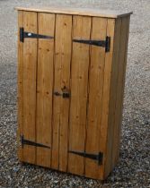 A rustic waxed pine two door cupboard, 80 x 36 x 130 cm high