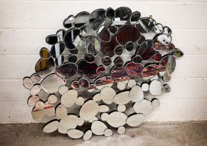 A modern abstract 'pebble' design mirror, 127 cm wide x 114 cm high