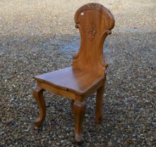 A carved pitch pine hall chair