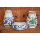 Two Poole pottery vases with stylized floral-painted decoration, 15 cm, to/w a 14.5 cm diameter