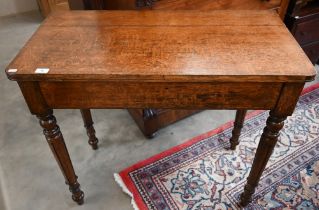 An antique oak side table with drawer to one end, raised on turned supports, 92 cm x 46 x 82 cm high