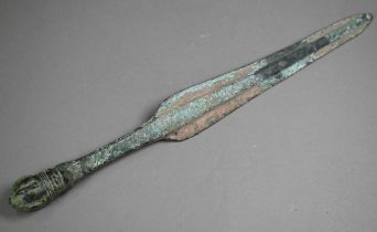 A Bronze Age shortsword, the shaped blade with thick raised midrib, with crown pommel, 41.5 cm