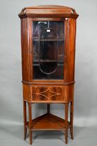 An Edwardian Sheraton Revival style inlaid satinwood corner display cabinet, with astragal glazed