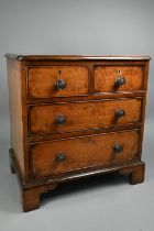 A late 19th century miniature mahogany chest of two short over two long graduated with metal