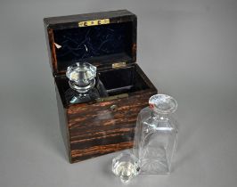 A Victorian brass bound Coromandel decanter box, retailed by Leuchers, fitted with two decanters (