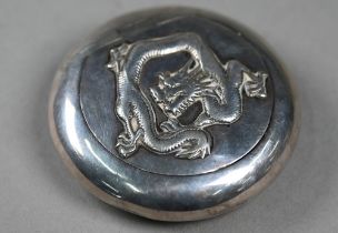 An antique Chinese silver pebble snuff-box, the sprung cover with applied dragon motif, maker Kwan