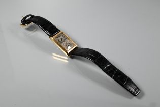 An 18ct gold 1930s Duo Dial gents wristwatch, the silvered rectangular dial with roman numerals,